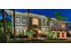 Elegant two-story home featuring lush landscaping and an inviting stone facade with beautiful architectural details at 4313 W Beachway Dr, Tampa, FL 33609