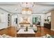 Spacious living room with hardwood floors, designer lighting, and comfortable seating at 4313 W Beachway Dr, Tampa, FL 33609
