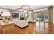 Bright living room with hardwood floors, designer touches, and access to outdoor space at 4313 W Beachway Dr, Tampa, FL 33609