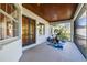 Spacious covered patio featuring exercise equipment and french doors at 4313 W Beachway Dr, Tampa, FL 33609