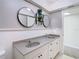 Bathroom features double sinks, framed mirrors, and white wainscotting at 4405 Vieux Carre Cir # 4405, Tampa, FL 33613