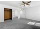 Bedroom featuring carpeted floors and mirrored closet doors at 4405 Vieux Carre Cir # 4405, Tampa, FL 33613