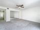 Bright bedroom features carpet floors, ceiling fan, and a closet with mirrored doors at 4405 Vieux Carre Cir # 4405, Tampa, FL 33613