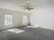 Spacious carpeted bedroom with two large windows at 4405 Vieux Carre Cir # 4405, Tampa, FL 33613
