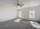 Bright carpeted bedroom with two large windows at 4405 Vieux Carre Cir # 4405, Tampa, FL 33613