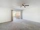 Bright bedroom features carpet floors, ceiling fan, and a door leading to a balcony at 4405 Vieux Carre Cir # 4405, Tampa, FL 33613