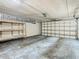 Spacious garage featuring shelving and an automatic door, offering ample storage and convenience at 4405 Vieux Carre Cir # 4405, Tampa, FL 33613