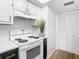 Bright kitchen features updated appliances, white subway tile, and ample storage at 4405 Vieux Carre Cir # 4405, Tampa, FL 33613