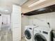 Laundry room features a modern washer and dryer and some storage at 4405 Vieux Carre Cir # 4405, Tampa, FL 33613