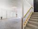 Bright living room with plush carpeting, chandelier, and staircase at 4405 Vieux Carre Cir # 4405, Tampa, FL 33613