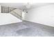 Living room with a staircase and contemporary chandelier at 4405 Vieux Carre Cir # 4405, Tampa, FL 33613