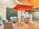 Inviting patio featuring stylish seating under an umbrella, creating a relaxing outdoor space at 4405 Vieux Carre Cir # 4405, Tampa, FL 33613