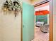 Charming outdoor patio area with stylish furniture, a vibrant orange umbrella, and decorative greenery at 4405 Vieux Carre Cir # 4405, Tampa, FL 33613
