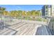 Spacious patio with wrought iron railings, offering a lovely view of surrounding trees and building at 4405 Vieux Carre Cir # 4405, Tampa, FL 33613