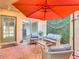 Serene patio with an umbrella, stylish furniture, and green wall, perfect for outdoor relaxation at 4405 Vieux Carre Cir # 4405, Tampa, FL 33613