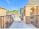 Inviting patio with decorative wrought iron railings, offering a scenic view and an archway for access at 4405 Vieux Carre Cir # 4405, Tampa, FL 33613