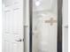 Bright walk-in shower with white tiling and glass door at 4405 Vieux Carre Cir # 4405, Tampa, FL 33613