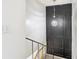 Staircase with black accent wall and chandelier at 4405 Vieux Carre Cir # 4405, Tampa, FL 33613