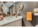 Modern bathroom features a sleek vanity, elegant mirror, and contemporary fixtures for a luxurious experience at 4705 1St Ne St # 326, St Petersburg, FL 33703
