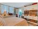Cozy bedroom with storage, a draped window and views to a home office at 4705 1St Ne St # 326, St Petersburg, FL 33703