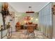 Bright dining room showcasing a pink table, stylish rug, and interesting decorative accents for an inviting space at 4705 1St Ne St # 326, St Petersburg, FL 33703