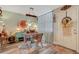 Eclectic dining room featuring a rustic light fixture, a colorful rug, and decorative accents creating a cozy atmosphere at 4705 1St Ne St # 326, St Petersburg, FL 33703