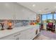 Sleek kitchen showcasing white cabinetry, elegant countertops, and modern appliances for cooking and entertaining at 4705 1St Ne St # 326, St Petersburg, FL 33703