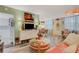 Bright living room featuring eclectic decor, unique lighting and access to an adjacent dining area at 4705 1St Ne St # 326, St Petersburg, FL 33703