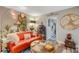 Charming living room showcases an leather sofa, unique decor, wooden floors, and natural light creating a welcoming atmosphere at 4705 1St Ne St # 326, St Petersburg, FL 33703