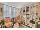 Stylish living room with a cozy seating area, a bookshelf feature, a neutral palette, and inviting natural light at 4705 1St Ne St # 326, St Petersburg, FL 33703