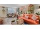 Cozy living room featuring eclectic decor, a stylish couch, and unique lighting for a comfortable living space at 4705 1St Ne St # 326, St Petersburg, FL 33703