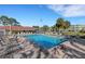 Beautiful community pool surrounded by lush landscaping, comfortable seating, and a clubhouse at 4705 1St Ne St # 326, St Petersburg, FL 33703