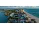 Expansive aerial view of a coastal area with beach, condos, and city streets at 4950 Gulf Blvd # 409, St Pete Beach, Fl, FL 33706