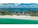 Beautiful aerial view of a beachfront condo with pristine sands and crystal-clear turquoise waters at 4950 Gulf Blvd # 409, St Pete Beach, Fl, FL 33706