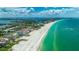 Stunning aerial showcasing the beautiful sandy beach and oceanfront condo with breathtaking views at 4950 Gulf Blvd # 409, St Pete Beach, Fl, FL 33706