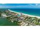 Scenic aerial view of beachfront condo and coastline, conveniently located near shops and restaurants at 4950 Gulf Blvd # 409, St Pete Beach, Fl, FL 33706