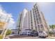 The Beau Monde condominium exterior featuring a view of the parking and main building at 4950 Gulf Blvd # 409, St Pete Beach, Fl, FL 33706