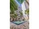 Beautiful courtyard featuring a fountain, seating, and lush landscaping at 4950 Gulf Blvd # 409, St Pete Beach, Fl, FL 33706