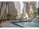 Patio with outdoor seating overlooking the fountain and landscaping at 4950 Gulf Blvd # 409, St Pete Beach, Fl, FL 33706