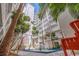 Beautiful outdoor courtyard with water fountain and multiple story balconies at 4950 Gulf Blvd # 409, St Pete Beach, Fl, FL 33706