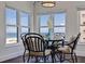 Dining area with ocean views, and seating for four at 4950 Gulf Blvd # 409, St Pete Beach, Fl, FL 33706