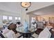 Elegant dining area with seating for four, hardwood floors, neighborhood views, and an open layout at 4950 Gulf Blvd # 409, St Pete Beach, Fl, FL 33706
