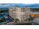 Exterior daytime shot of a high-rise beachfront condo building on a beautiful sandy beach at 4950 Gulf Blvd # 409, St Pete Beach, Fl, FL 33706