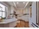 Bright kitchen features wood floors, stainless steel appliances, recessed lighting and granite countertops at 4950 Gulf Blvd # 409, St Pete Beach, Fl, FL 33706