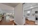 Bright and airy living room leading to dining room and kitchen, featuring beautiful flooring at 4950 Gulf Blvd # 409, St Pete Beach, Fl, FL 33706