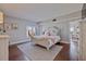 Inviting main bedroom features a king bed, dresser, ensuite, with a view to the outside at 4950 Gulf Blvd # 409, St Pete Beach, Fl, FL 33706