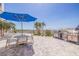Community patio area with grill, seating and palm trees at 4950 Gulf Blvd # 409, St Pete Beach, Fl, FL 33706