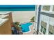 Poolside view of the pool with ocean and beach views at 4950 Gulf Blvd # 409, St Pete Beach, Fl, FL 33706