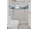 Updated bathroom featuring a rain shower head and mosaic tiling at 5526 Southernview Dr, Zephyrhills, FL 33541