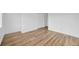 Bedroom features wood-look flooring and ample closet space at 5526 Southernview Dr, Zephyrhills, FL 33541
